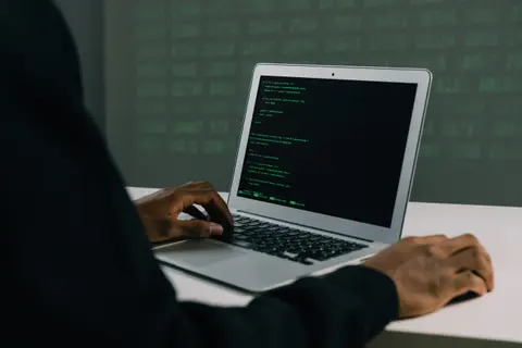 Person on a laptop with IT security